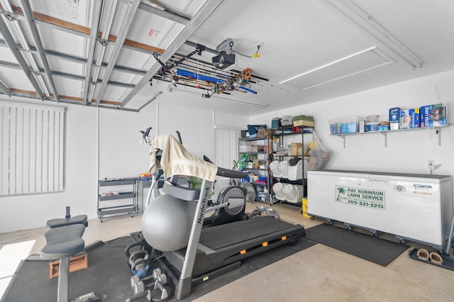 exercise room with a textured ceiling