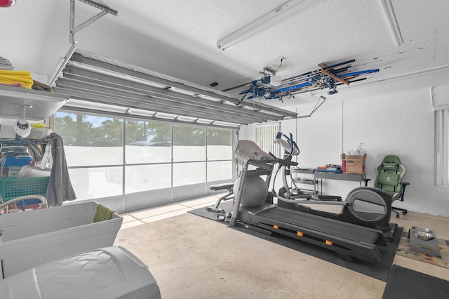 exercise area featuring sink and a textured ceiling