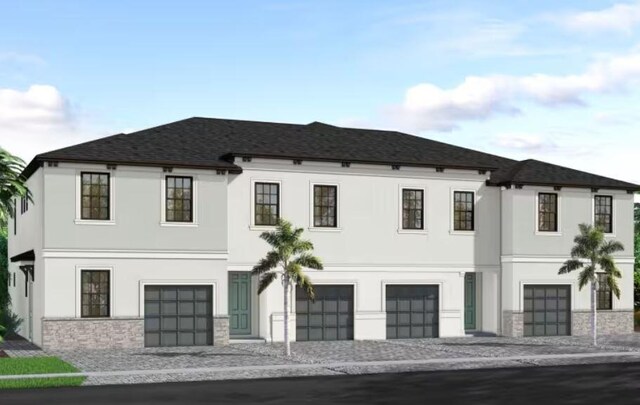 view of front of property with stucco siding, driveway, stone siding, a shingled roof, and a garage