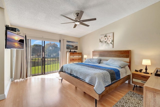 bedroom with vaulted ceiling, light wood-type flooring, access to outside, ceiling fan, and a textured ceiling