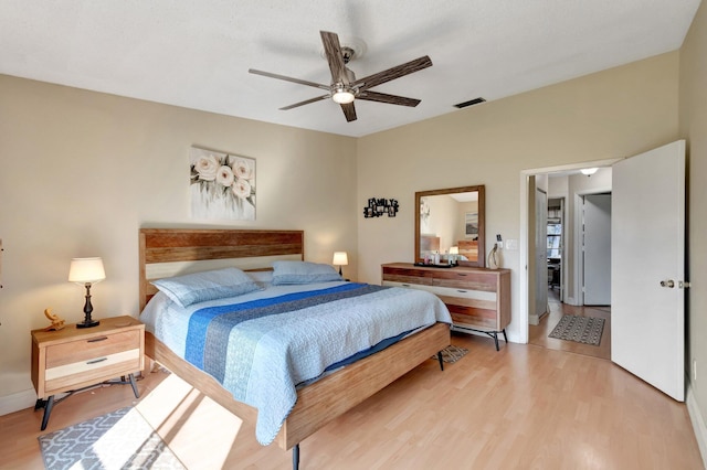 bedroom with hardwood / wood-style floors and ceiling fan