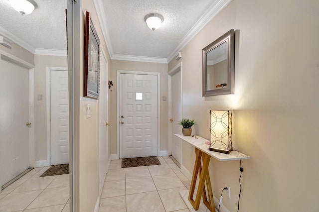 foyer featuring light tile patterned floors, ornamental molding, and a textured ceiling