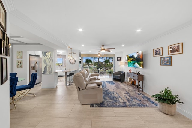 living room featuring ceiling fan and ornamental molding