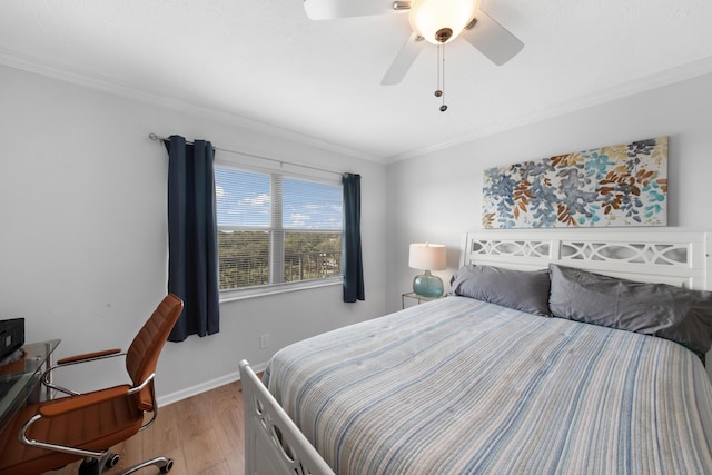 bedroom with light hardwood / wood-style flooring, ceiling fan, and ornamental molding