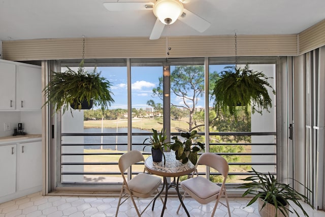 sunroom / solarium with ceiling fan and plenty of natural light