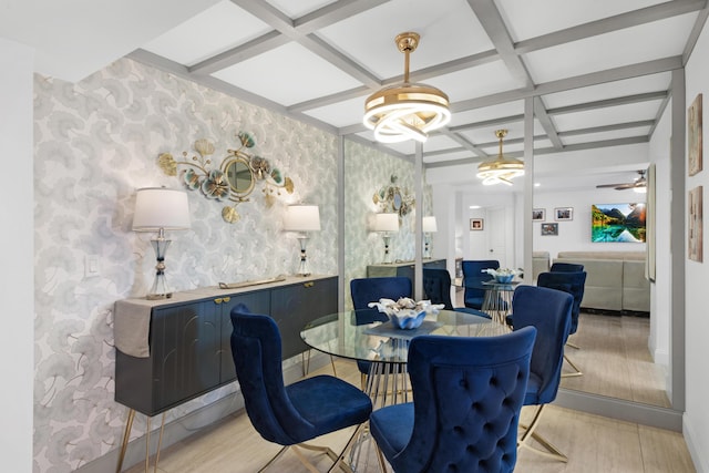 dining space featuring coffered ceiling and beam ceiling