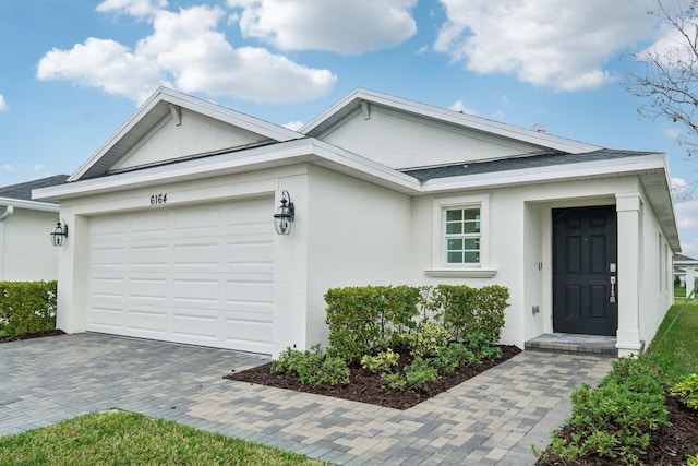 ranch-style home with a garage