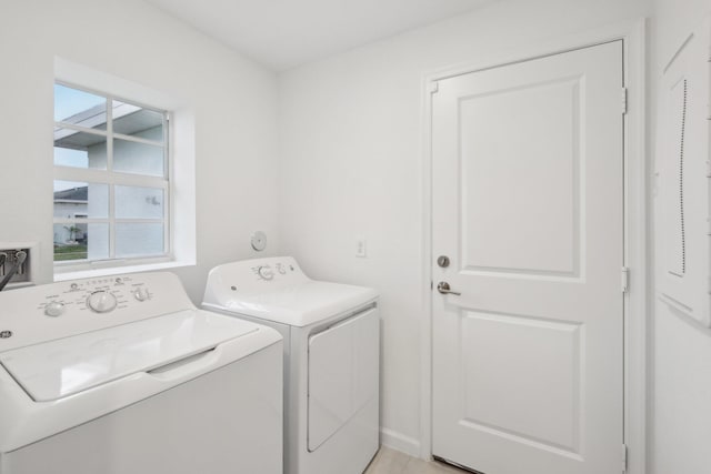 washroom featuring washer and clothes dryer