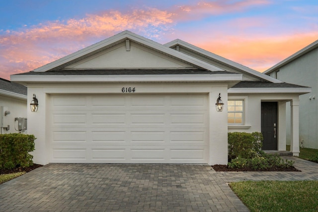 view of front of home with a garage