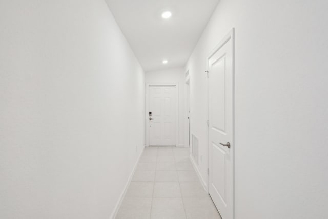 hallway featuring light tile patterned flooring