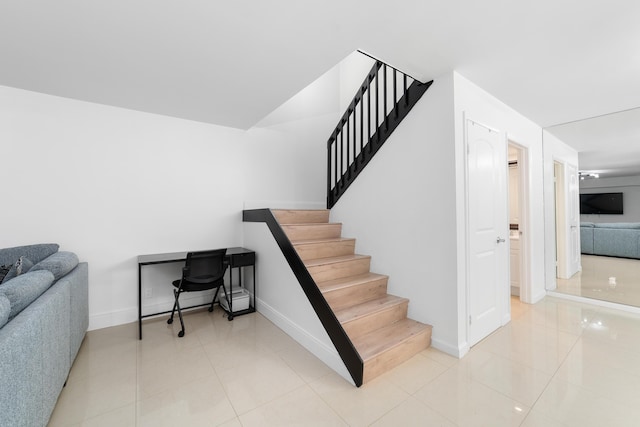 stairs with tile patterned floors