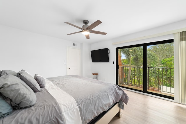 bedroom with access to exterior, ceiling fan, and light hardwood / wood-style flooring