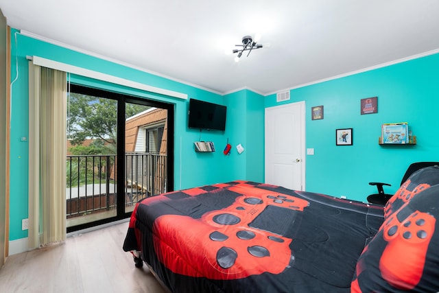 bedroom featuring crown molding, access to outside, and light wood-type flooring