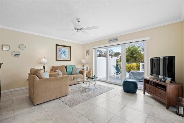 tiled living room with ceiling fan, a textured ceiling, and crown molding