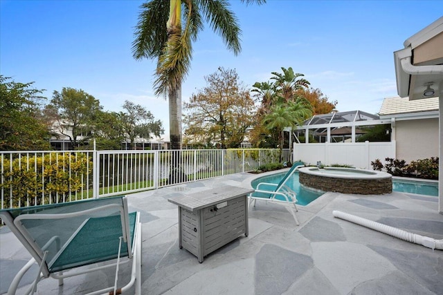 view of patio / terrace featuring a pool with hot tub