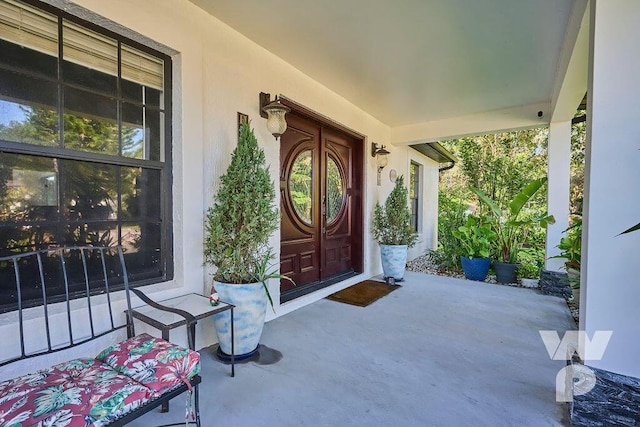 entrance to property featuring a porch