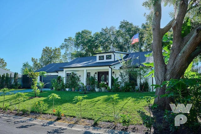 view of front facade with a garage and a front lawn