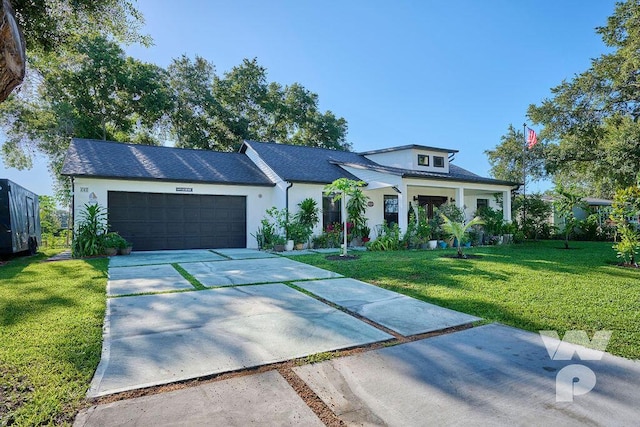 view of front of home featuring a garage and a front yard