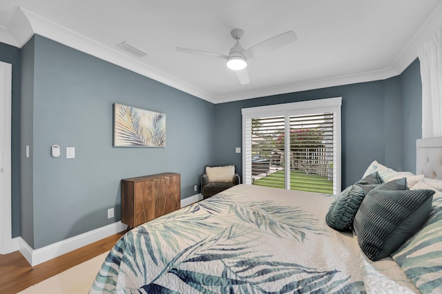 bedroom featuring ceiling fan, ornamental molding, and light wood-type flooring