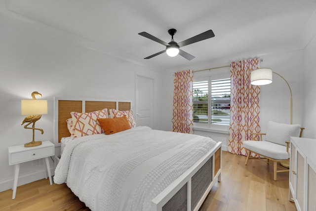 bedroom featuring ceiling fan and light hardwood / wood-style flooring