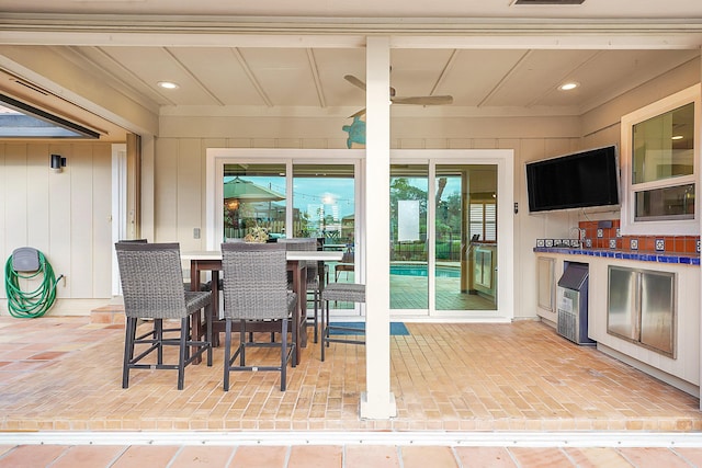 view of patio featuring ceiling fan