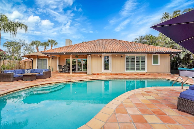 view of swimming pool with an outdoor living space and a patio area