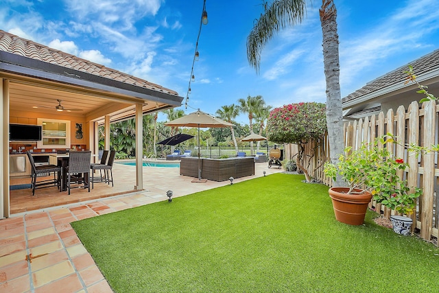 view of yard with an outdoor hangout area, a fenced in pool, and a patio area