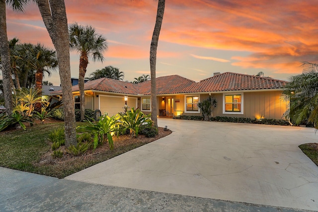 mediterranean / spanish-style house featuring a garage