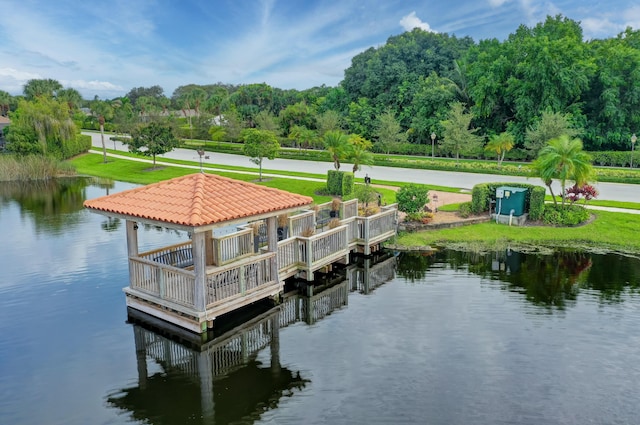 view of dock with a gazebo and a water view