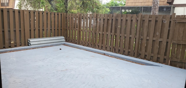 view of gate with a patio area