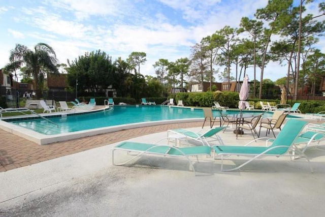 view of swimming pool with a patio