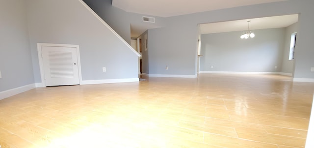 interior space featuring a notable chandelier and light hardwood / wood-style floors