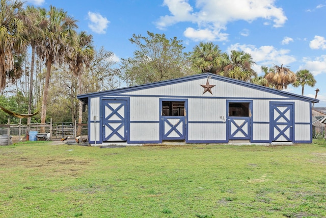 view of outdoor structure with a lawn