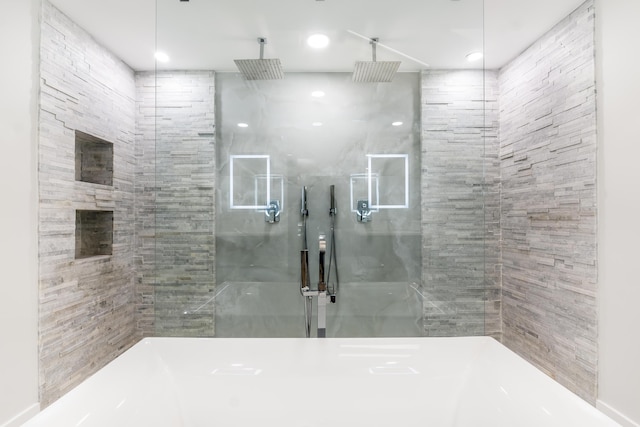 bathroom with tiled shower