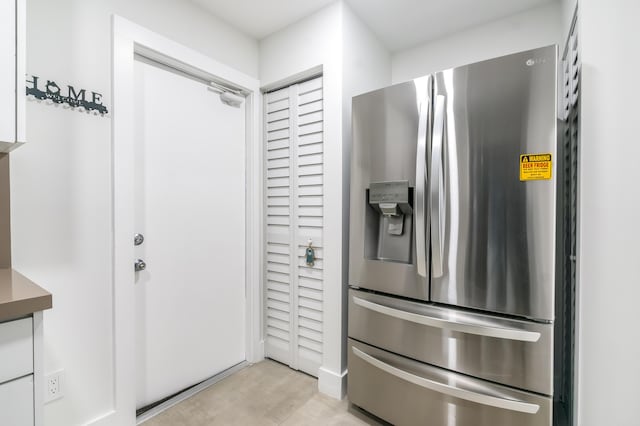 kitchen with stainless steel refrigerator with ice dispenser