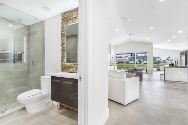 bathroom featuring a shower with door, vanity, lofted ceiling, and toilet