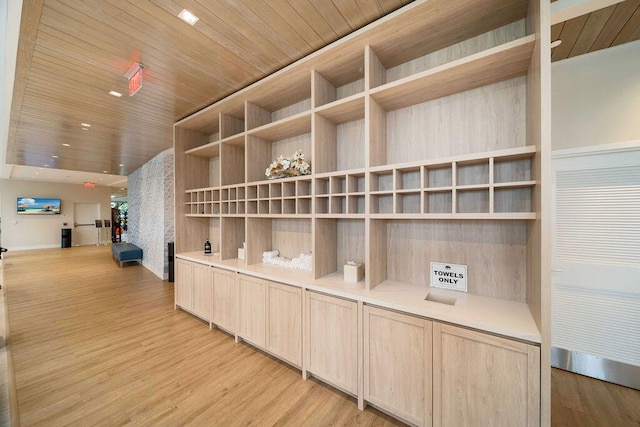 interior space featuring wood ceiling and light hardwood / wood-style floors