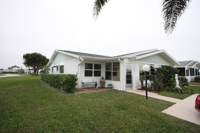 view of front of home with a front yard