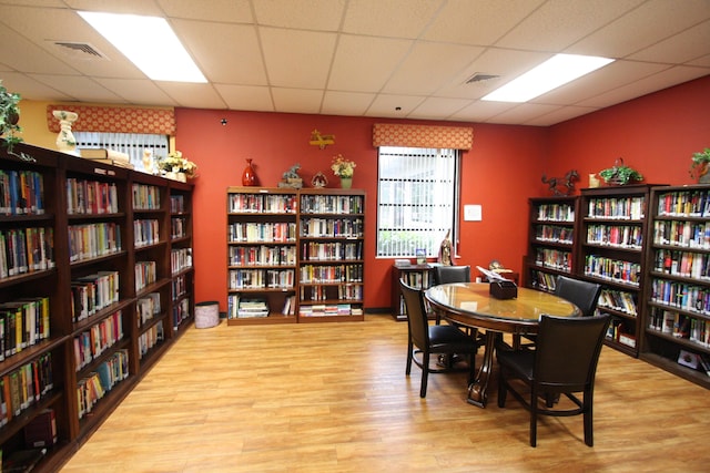 interior space featuring light hardwood / wood-style flooring and a paneled ceiling