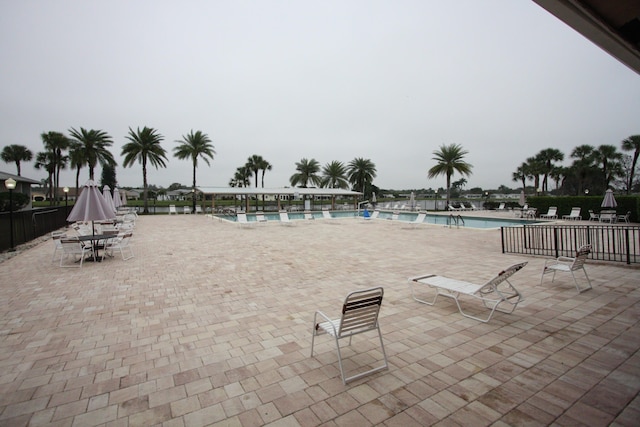 view of swimming pool with a patio