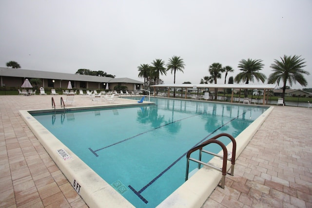 view of swimming pool with a patio area