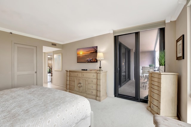 carpeted bedroom featuring ornamental molding and access to outside