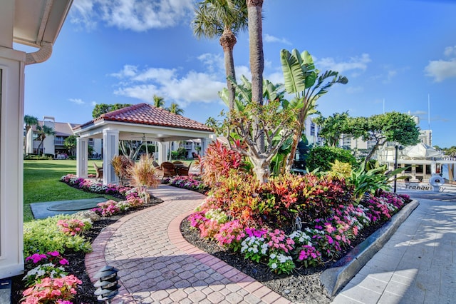 surrounding community featuring a gazebo and a yard