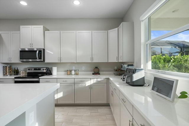 kitchen featuring white cabinets and stainless steel appliances