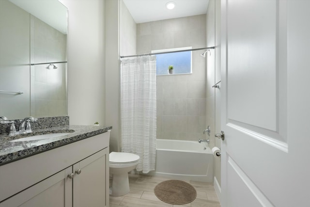 full bathroom featuring vanity, toilet, and shower / tub combo with curtain