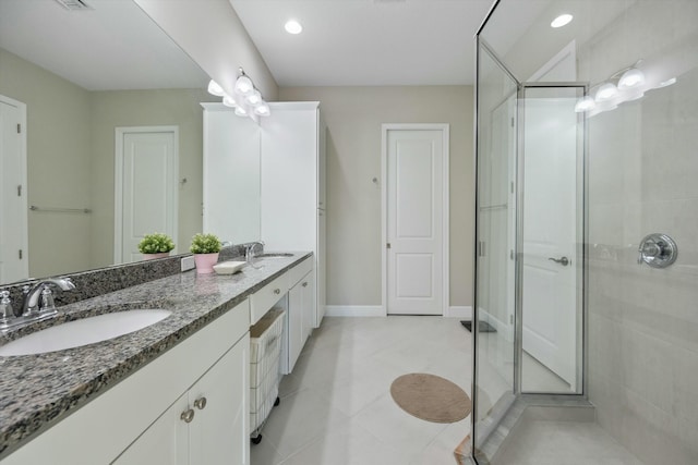 bathroom featuring vanity, tile patterned floors, and an enclosed shower