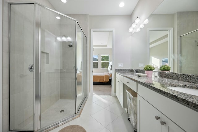 bathroom featuring vanity, walk in shower, and tile patterned floors