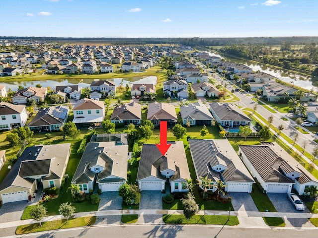 birds eye view of property featuring a water view