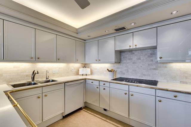 kitchen with dishwashing machine, sink, black electric stovetop, white cabinets, and decorative backsplash