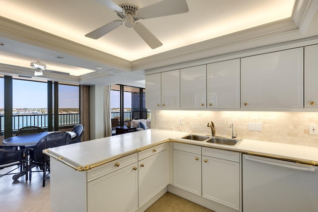 kitchen featuring a water view, white cabinetry, white dishwasher, and kitchen peninsula